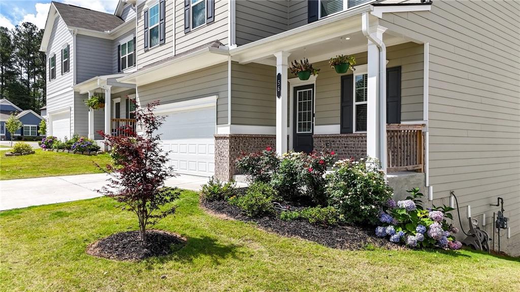 56 Preserve Point Jasper, GA 30143 - Photo 6 of 49 a front view of a house with garden