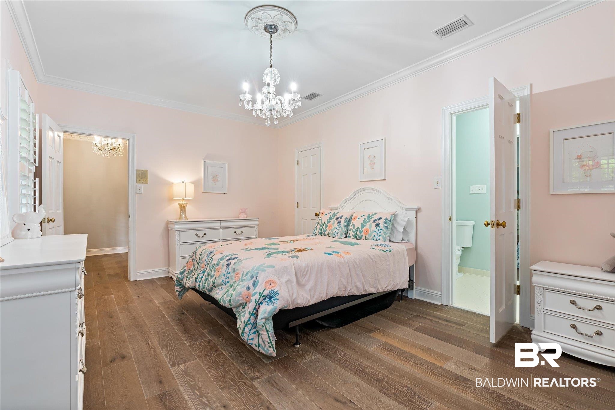 5324 Oak Bend Court Mobile, AL 36609 - Photo 30 of 49 Bedroom featuring crown molding, visible vents, wood finished floors, baseboards, and a notable chandelier
