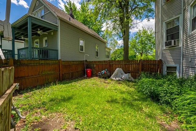 a view of backyard and tree