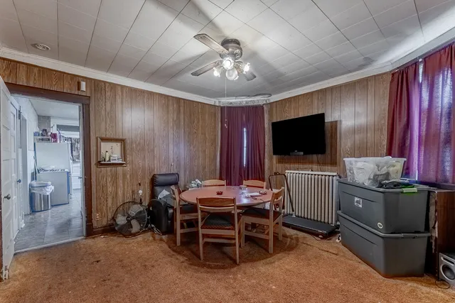 a room with furniture windows and a flat screen tv