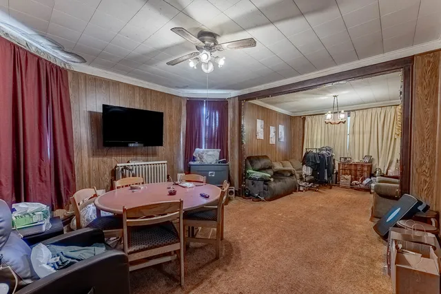 a view of a livingroom with furniture and a flat screen tv