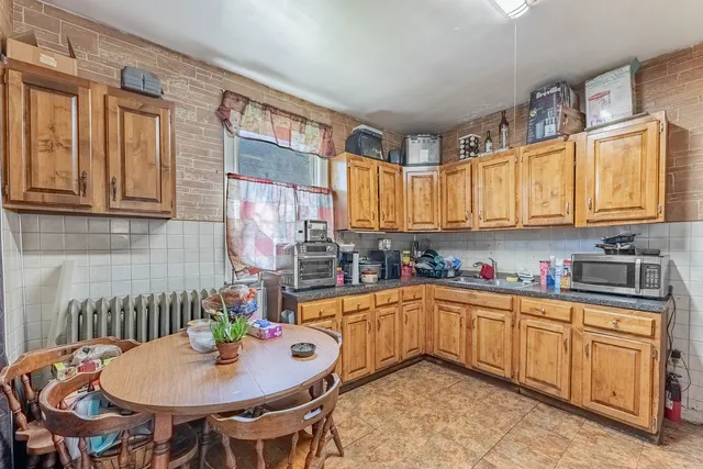 a kitchen with a sink and cabinets