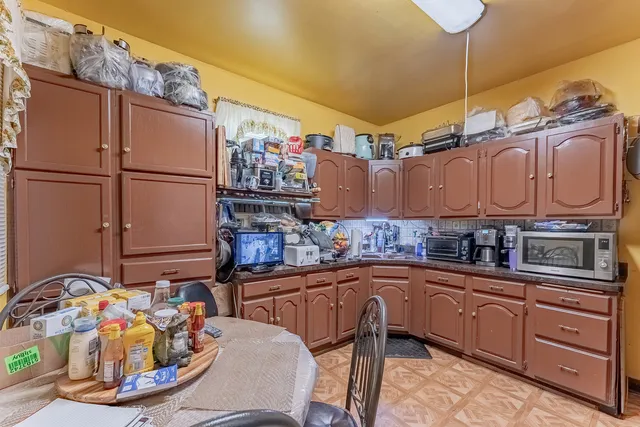 a kitchen with stainless steel appliances granite countertop a sink and cabinets