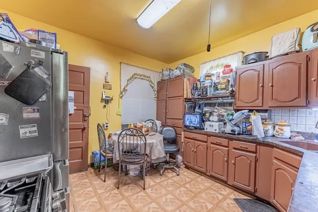 a kitchen with stainless steel appliances a sink and cabinets