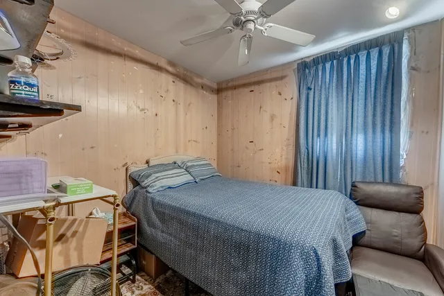 a bedroom with a bed and furniture