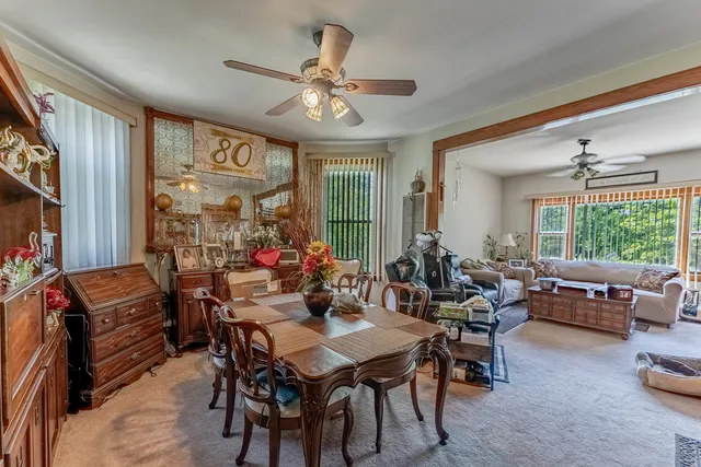 a view of a dining room with furniture window and outside view