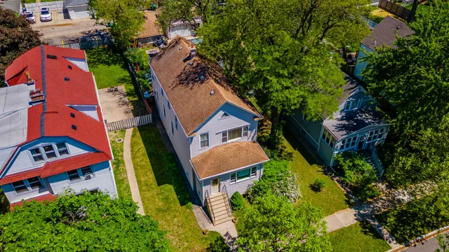 an aerial view of residential house with outdoor space and swimming pool