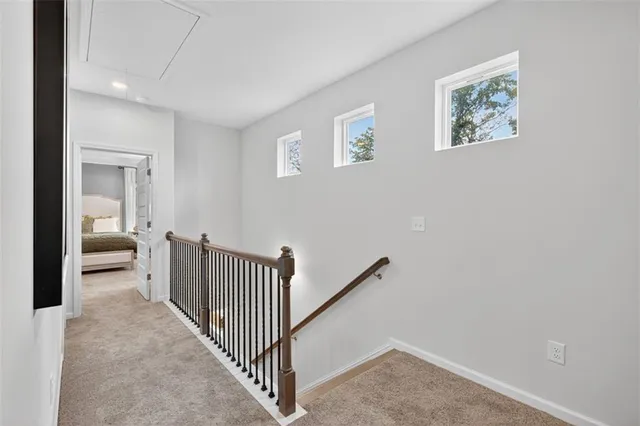 a view of a hallway with a livingroom and a couch