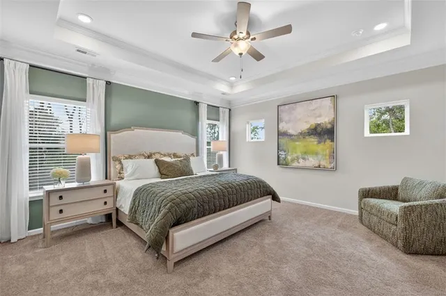 a spacious bedroom with a bed and a couch