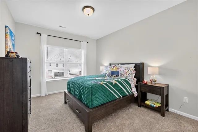 a bedroom with a bed and a cabinets