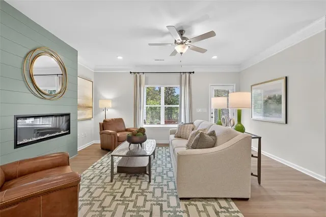 a living room with furniture and a large window