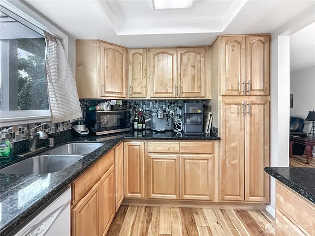 a bedroom with a bed and a lamp