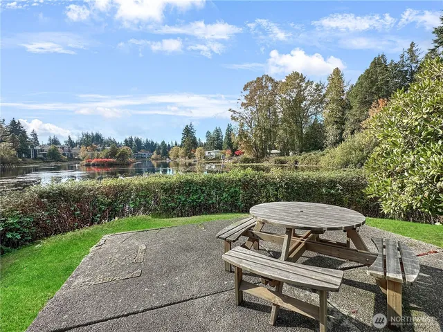 a view of a balcony with wooden fence