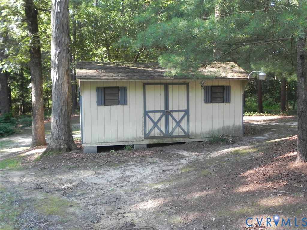 830 Grapevine Road Sandston, VA 23150 - Photo 13 of 16 Freestanding shed with horizontal panel siding, do