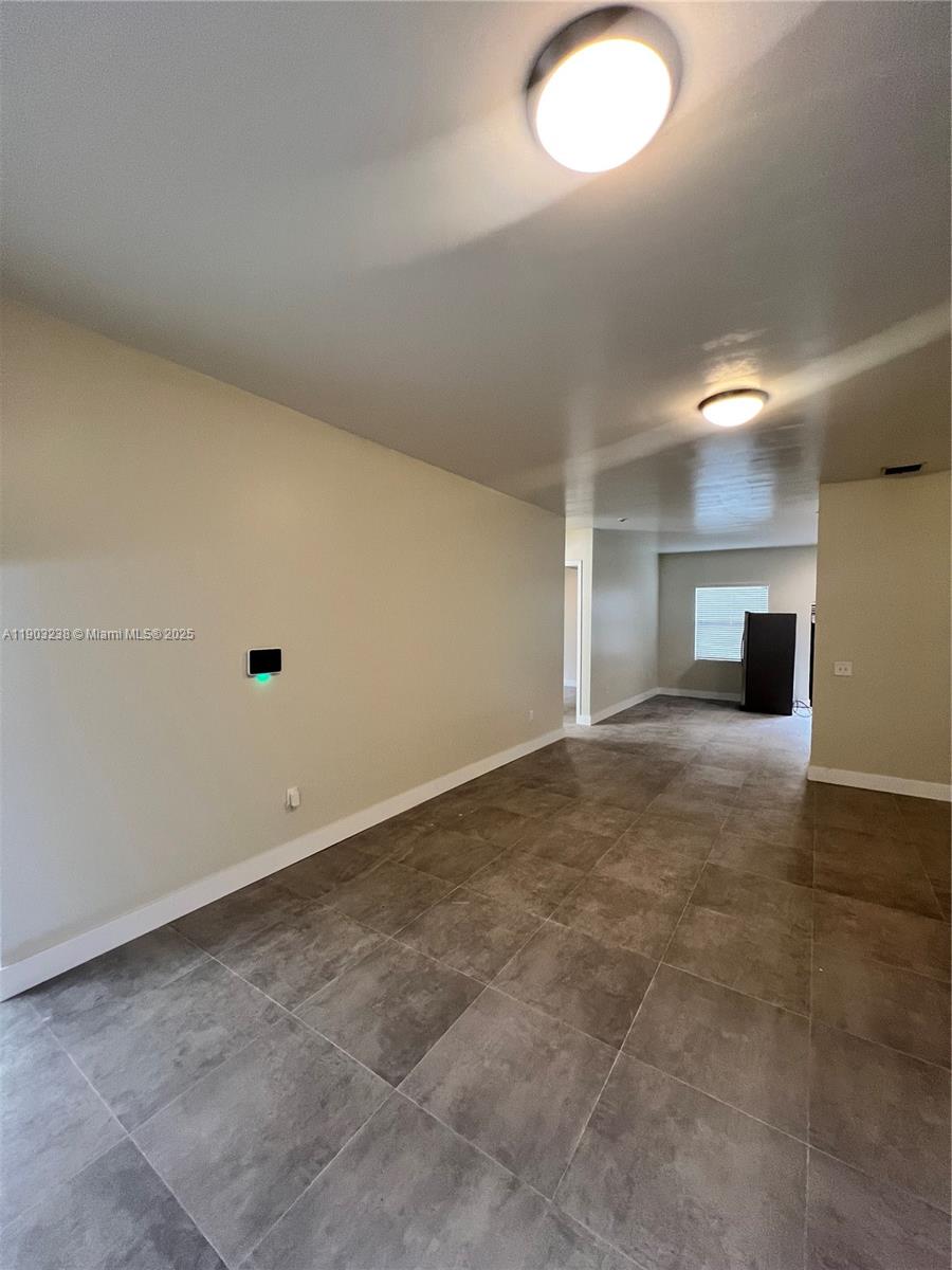 10274 Southwest 180th Street, Unit 1 Miami, FL 33157 - Photo 13 of 17 a view of a livingroom with a stove