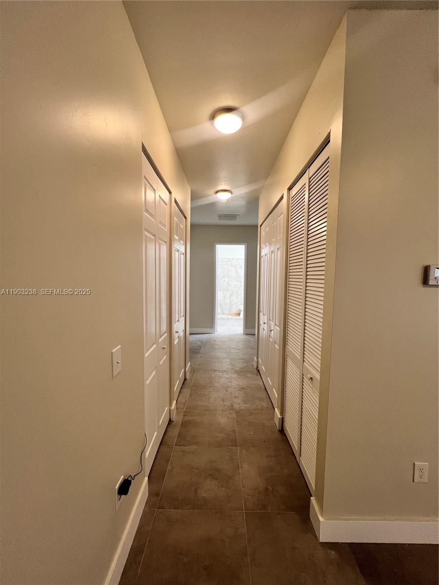 10274 Southwest 180th Street, Unit 1 Miami, FL 33157 - Photo 15 of 17 a view of a hallway