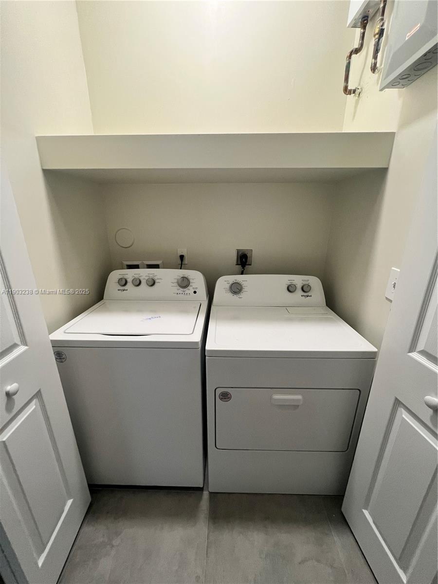 10274 Southwest 180th Street, Unit 1 Miami, FL 33157 - Photo 17 of 17 a utility room with dryer and washer
