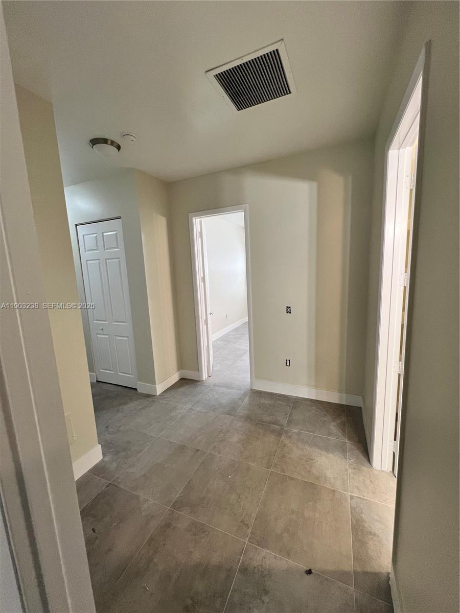 10274 Southwest 180th Street, Unit 1 Miami, FL 33157 - Photo 4 of 17 a view of an empty room