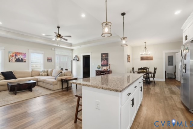 15305 Keelers Mill Road Dewitt, VA 23840 - Photo 11 of 38 a living room with furniture kitchen view and a chandelier