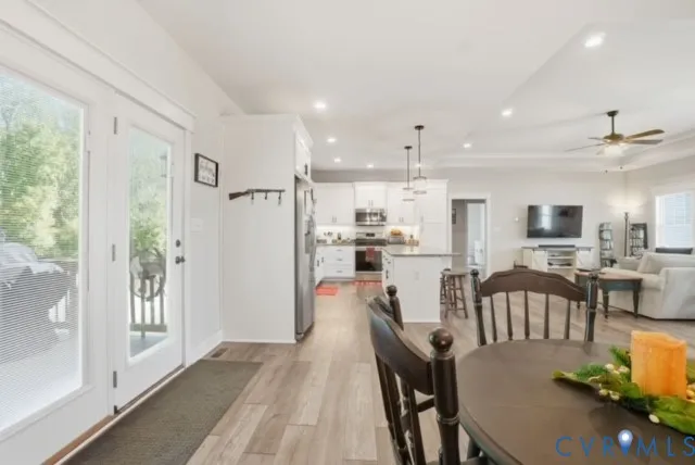 a view of a dining room with furniture window and wooden floor