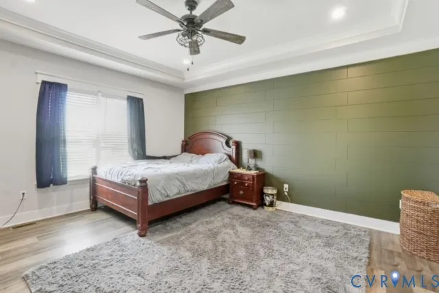 a view of room with furniture and wooden floor