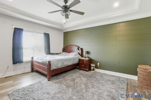 15305 Keelers Mill Road Dewitt, VA 23840 - Photo 19 of 38 a bedroom with a bed and a chandelier