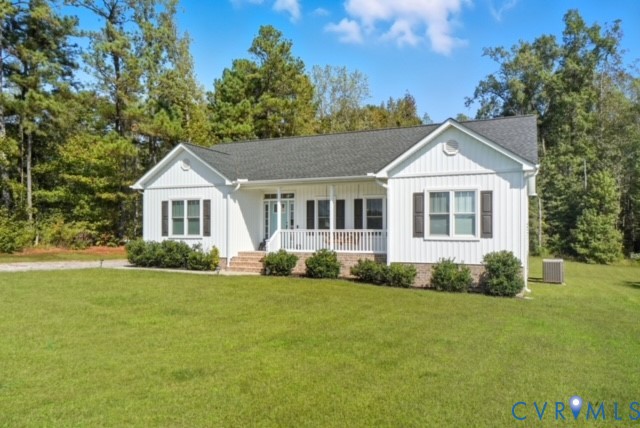 15305 Keelers Mill Road Dewitt, VA 23840 - Photo 2 of 38 a front view of a house with a garden