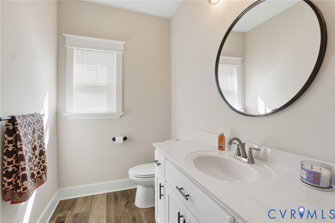 15305 Keelers Mill Road Dewitt, VA 23840 - Photo 27 of 38 a bathroom with a sink and a mirror