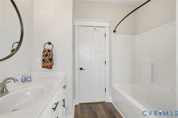 a bathroom with a bathtub and a sink