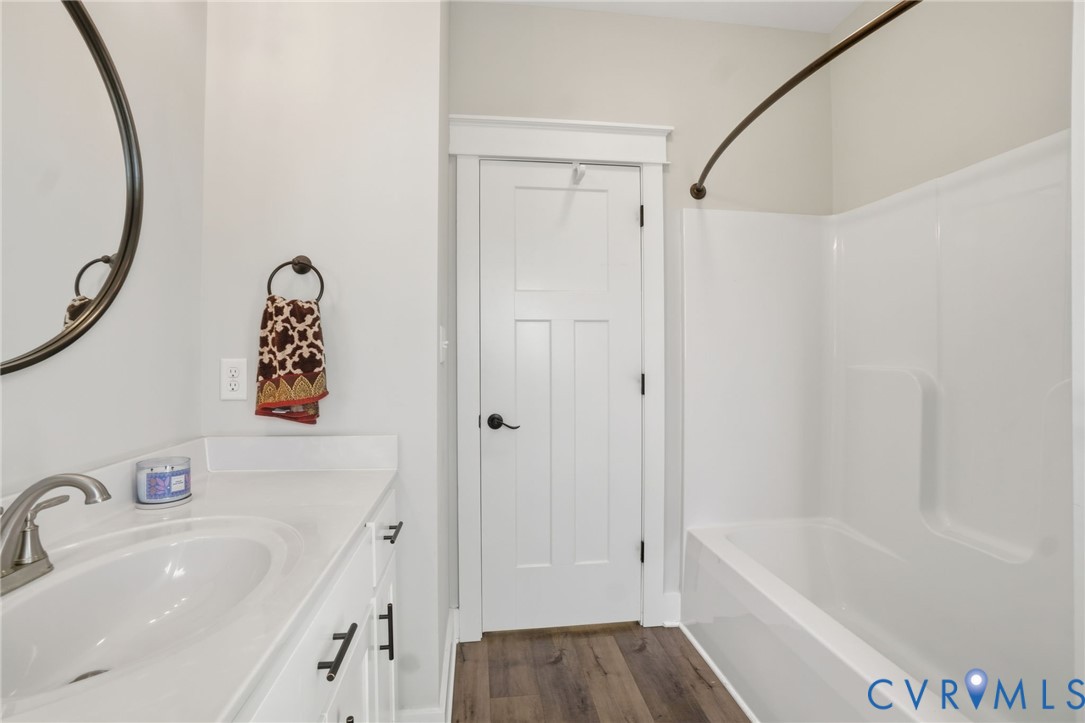 15305 Keelers Mill Road Dewitt, VA 23840 - Photo 28 of 38 a bathroom with a bathtub and a sink