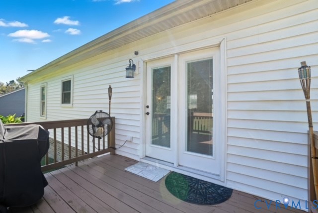 15305 Keelers Mill Road Dewitt, VA 23840 - Photo 30 of 38 a view of a deck with wooden floor and seating space