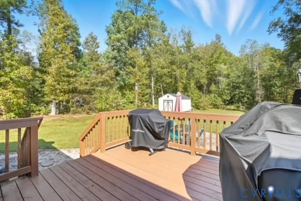 a view of roof deck with furniture