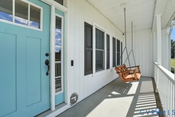 a wooden bench sitting in front of a building