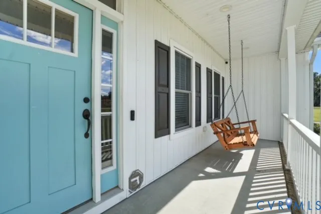 a wooden bench sitting in front of a building