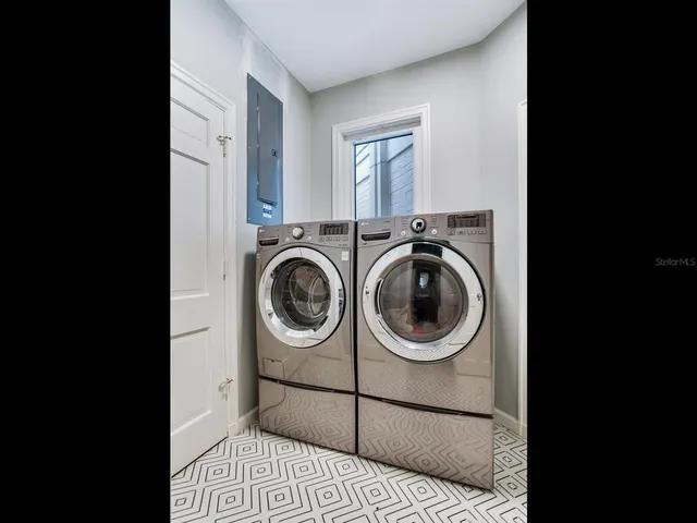 a utility room with dryer and washer