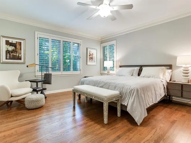 a bathroom with a sink vanity mirror and toilet