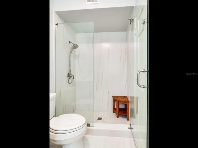 a view of a table and chairs in the patio