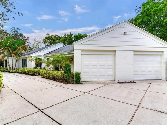 a front view of a house with garage