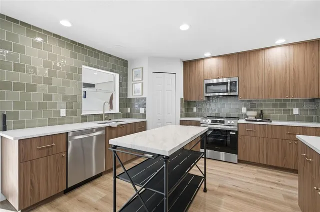 a kitchen with a stove and a microwave