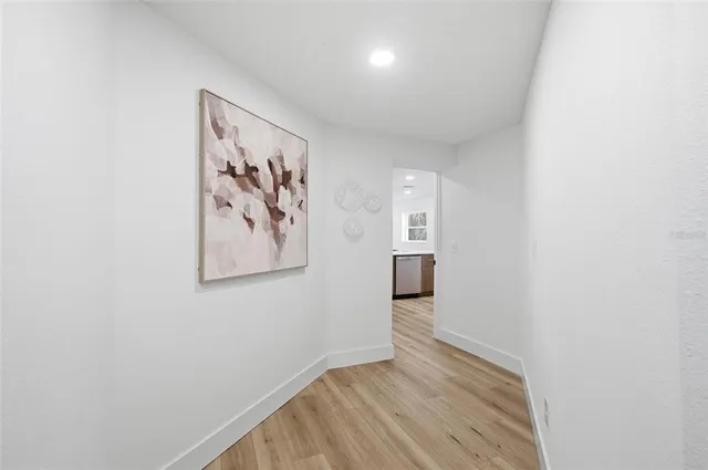 a kitchen with granite countertop a sink and cabinets