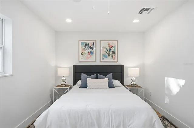 a view of staircase with white walls and railing