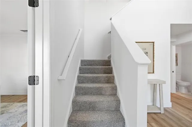 a view of a hallway with white walls