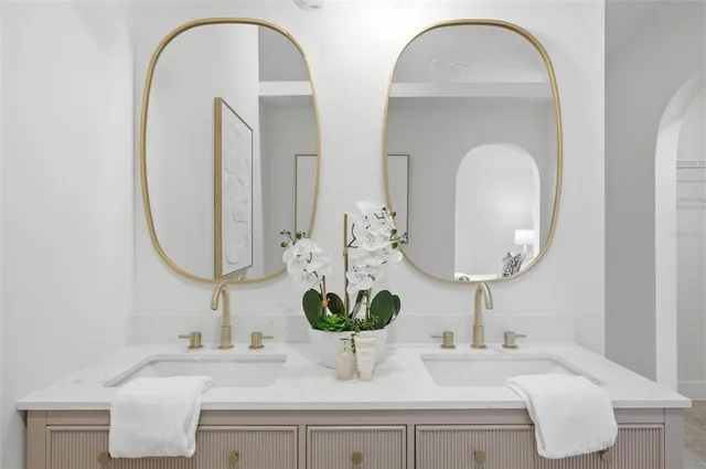 a bedroom with a bed and a mirror