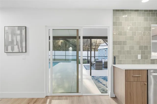 a living room with furniture a rug and a table