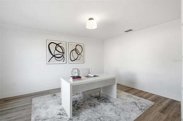 a view of a livingroom with furniture and wooden floor
