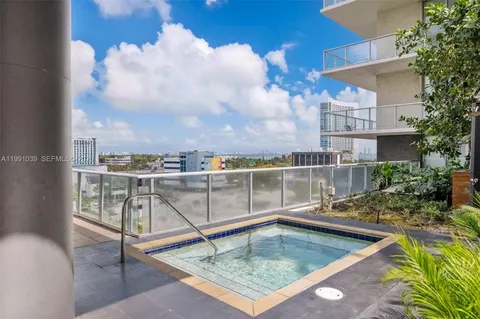 a view of a swimming pool with a lounge chairs