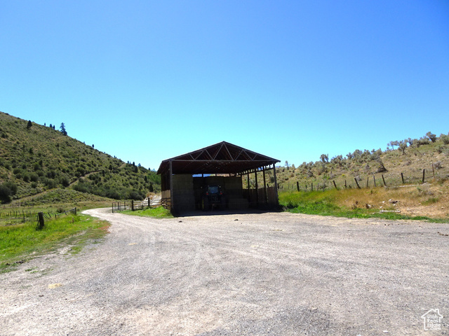 34685 Highway 30 Georgetown, ID 83239 - Photo 15 of 21 View of outbuilding featuring a view of countryside, gravel driveway, and a detached carport