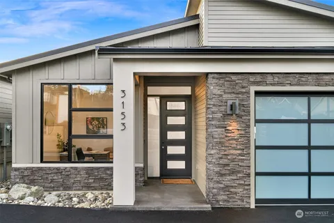 a front view of a house with a glass door