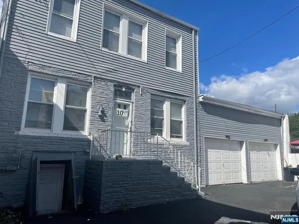 a front view of a house with a garage