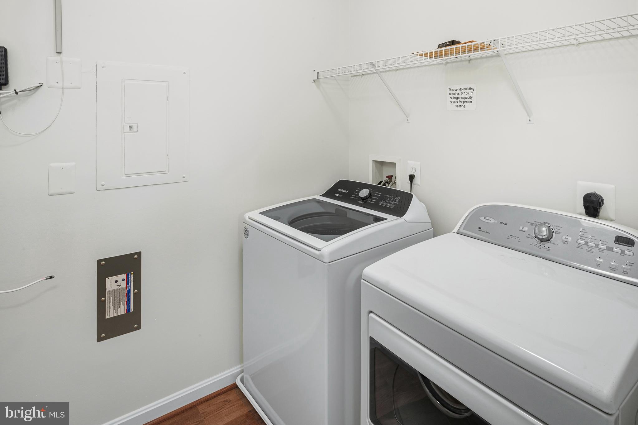 8601 Roaming Ridge Way, Unit 304 Odenton, MD 21113 - Photo 25 of 40 a utility room with dryer and washer